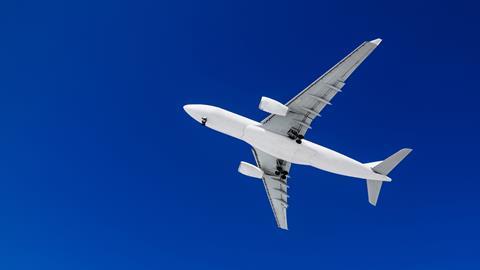 Passenger airplane on a blue sky background. 