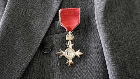 An image showing a British MBE medal