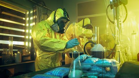 Breaking bad concept image - two masked chemists making drugs 