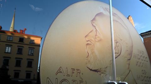 Portrait of Alfred Nobel at door entrance in the Nobel Prize Museum is located in the Old Town of Stockholm