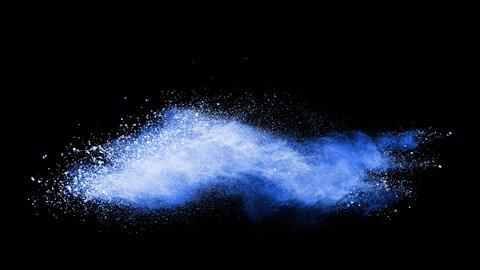 An image of a powder with a faint blue glow