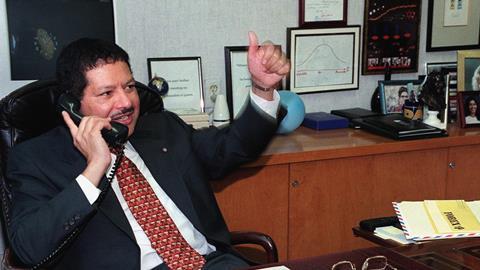 Dr. Ahmed Zewail talking on the phone in his office