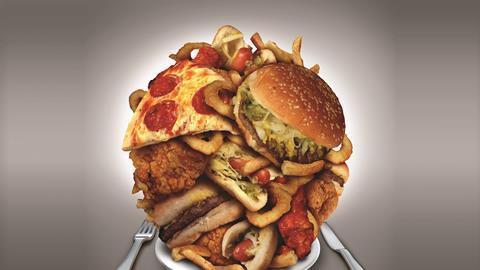 A piled up plate of junk food