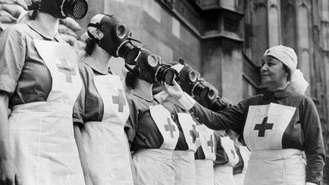 Nurses from the House of Lords Red Cross Detachment wearing gas masks,