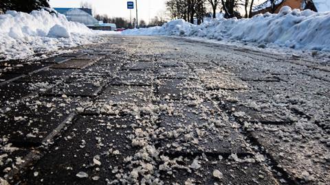 An icy footpath that has been gritted with rock salt