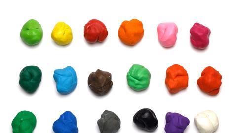 Colorful molded plasticine clay isolated on white background