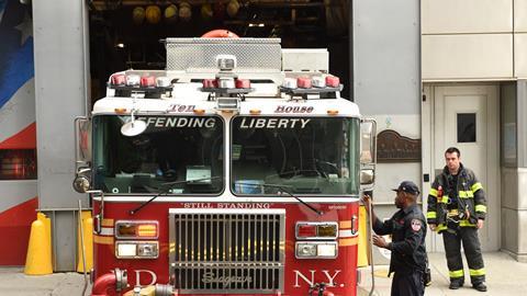 Firefighters and fire truck near the FDNY Ten House on Liberty Steet on lower Manhattan.