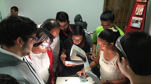 An image showing pupils working on an experiment 
