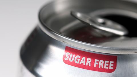 Close up of the rim of an open can of soft drink which has a label which says Sugar Free