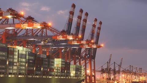 A container ship from China Shipping Line is loaded at the main container port in Hamburg, Germany