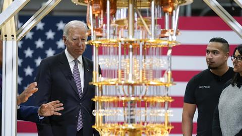 Joe Biden looking at a quantum computer