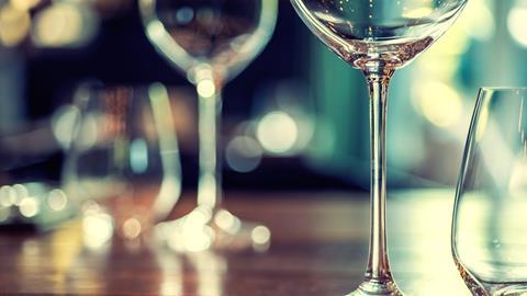 Close up of wine glasses on a wooden table