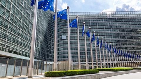 European Union flags in front of the European Commission headquarters in Brussels