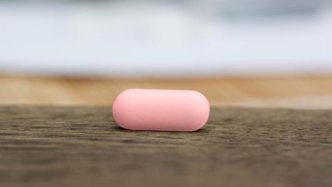 Flibanserin pill on a wooden counter