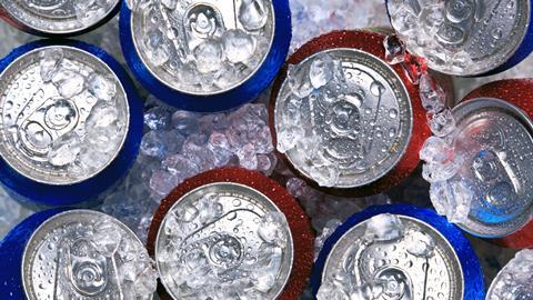 Cans of fizzy drinks on ice