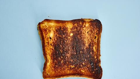 Burnt toast on a blue background