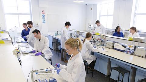 An image showing chemistry students in a laboratory
