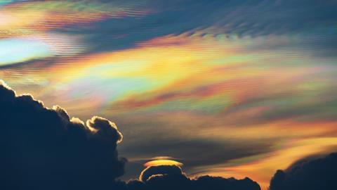 Clouds high in the atmosphere in rainbow colours like mother of pearl