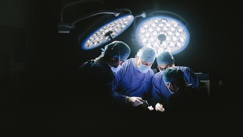 Several surgeons performing an operation