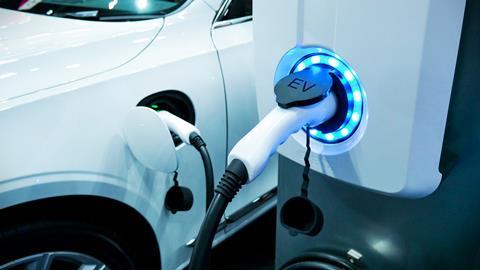 An image showing an electric car charging 