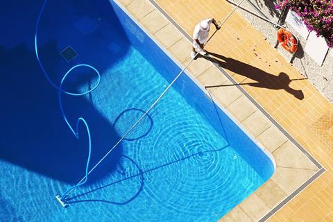 Man cleaning pool