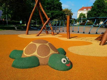 An image showing the figure of a turtle on the playground made of soft rubber crumbs