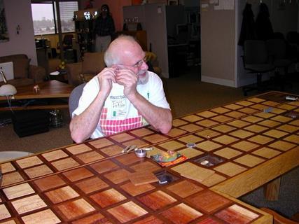 An image showing Theodore Gray sitting in front of a table formed of periodic table tiles