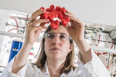 Claire Kammerer inspects a nanocar model