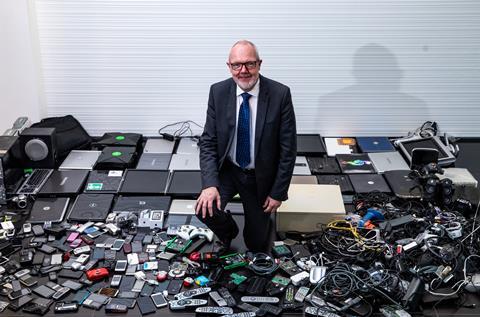 An image showing Robert Parker next to used electronics