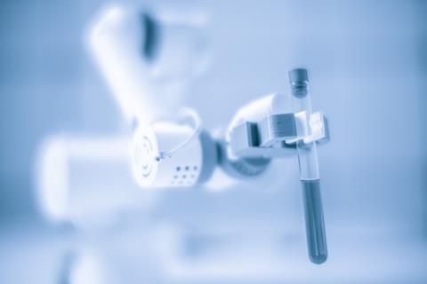 Robotic arm holding test tube