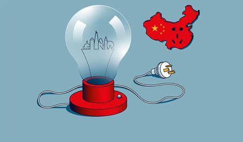 A lightbulb representing Europe unplugged from a power socket representing China