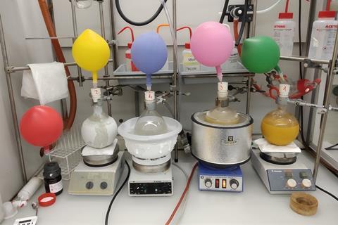 An image showing four ongoing reactions in a fumehood