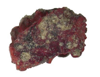 A photo showing the a piece of red and brown rock