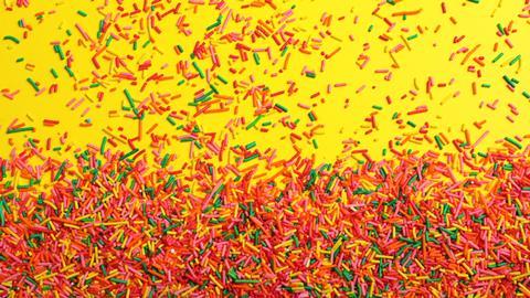 Hundreds and thousands on a yellow background