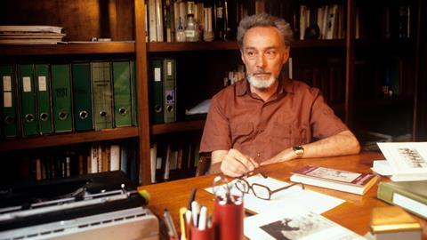 An image showing Primo Levi at his desk