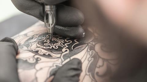 Tattoo being drawn