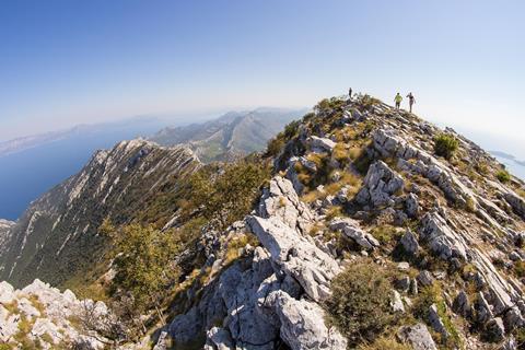 Top view on semi-arid dry rocky landscape on mountain ridge with the view on Mediterranean sea - south Croatia