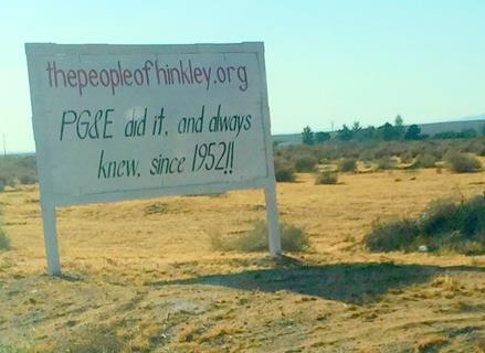 'PG&E did it, and always knew, since 1952!!' A billboard, outside the desert town of Hinkley, CA.