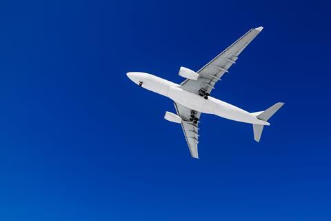 Passenger airplane on a blue sky background. 