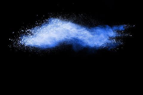 An image of powder with a faint blue glow