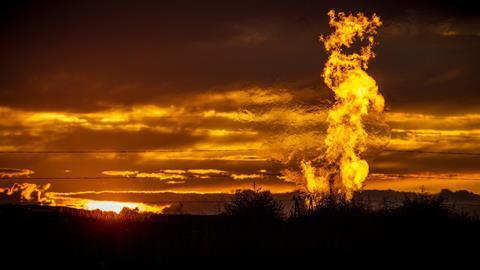 Flames from a flaring pit near a well in the Bakken Oil Field - hero (original)