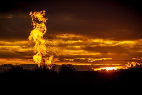 Flames from a flaring pit near a well in the Bakken Oil Field - flipped