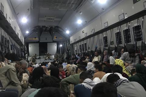 People crowded inside a military plane