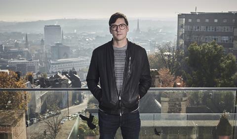 Portrait of Harry Destecroix on a rooftop overlooking the city of Briston