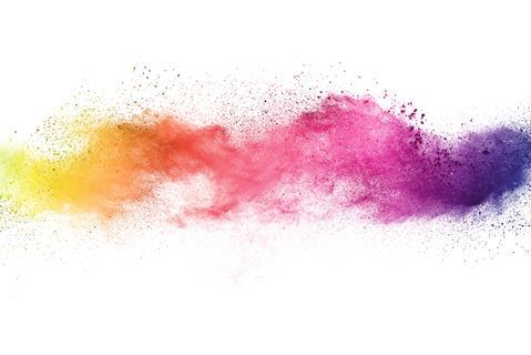 A splash of colourful powder pigments on a white background