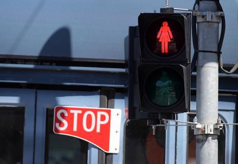 An image showing a red female traffic light