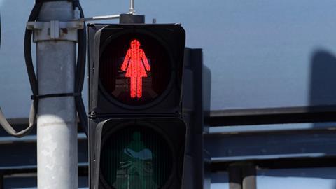 An image showing a red female traffic light