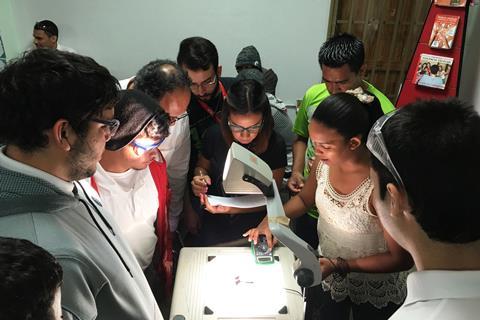 An image showing pupils working on an experiment 