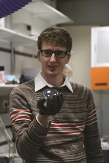 0318CW - Comment - Juris Meija holding the mole sphere