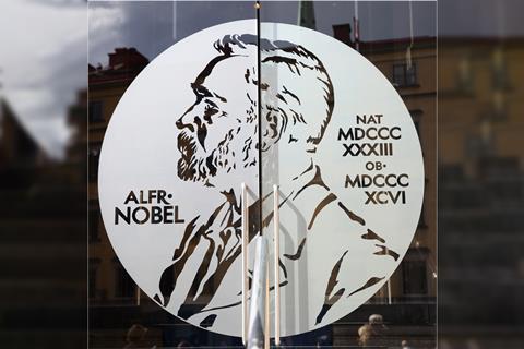 Portrait of Alfred Nobel on the glass door of Swedish Academy and Nobel Museum in Stockholm